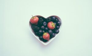 heart shaped bowl full of blueberries